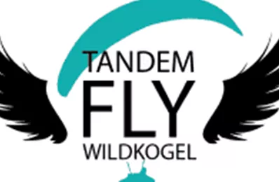 A logo with the inscription "TANDEM FLY WILDKOGEL" and a stylized wing design. It conveys the feeling of freedom and adventure in flight.