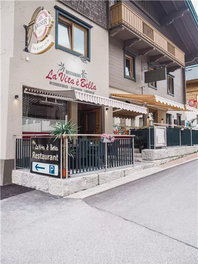 An inviting restaurant named "La Vita e Bella". The facade is welcoming and has a cozy atmosphere.