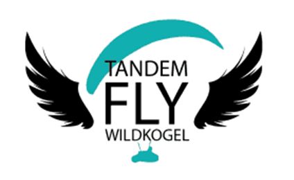 A logo with the inscription "TANDEM FLY WILDKOGEL" and a stylized wing design. It conveys the feeling of freedom and adventure in flight.